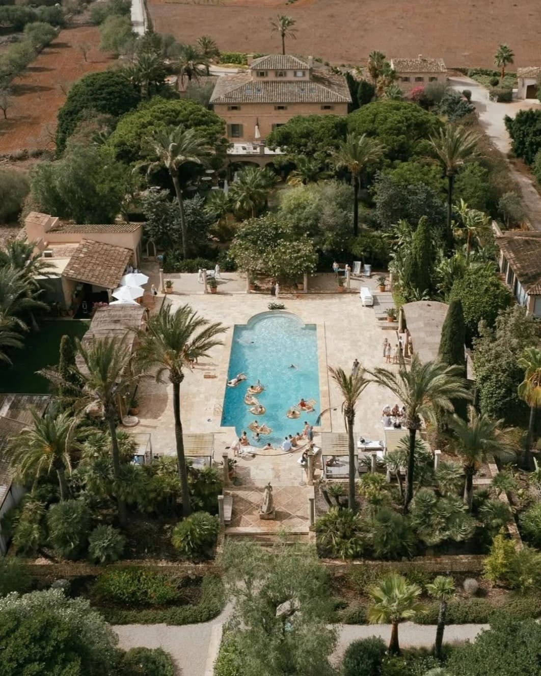 Aerial view of the Cal Reiet property in Santanyí, Mallorca, showing the main house, gardens and pool